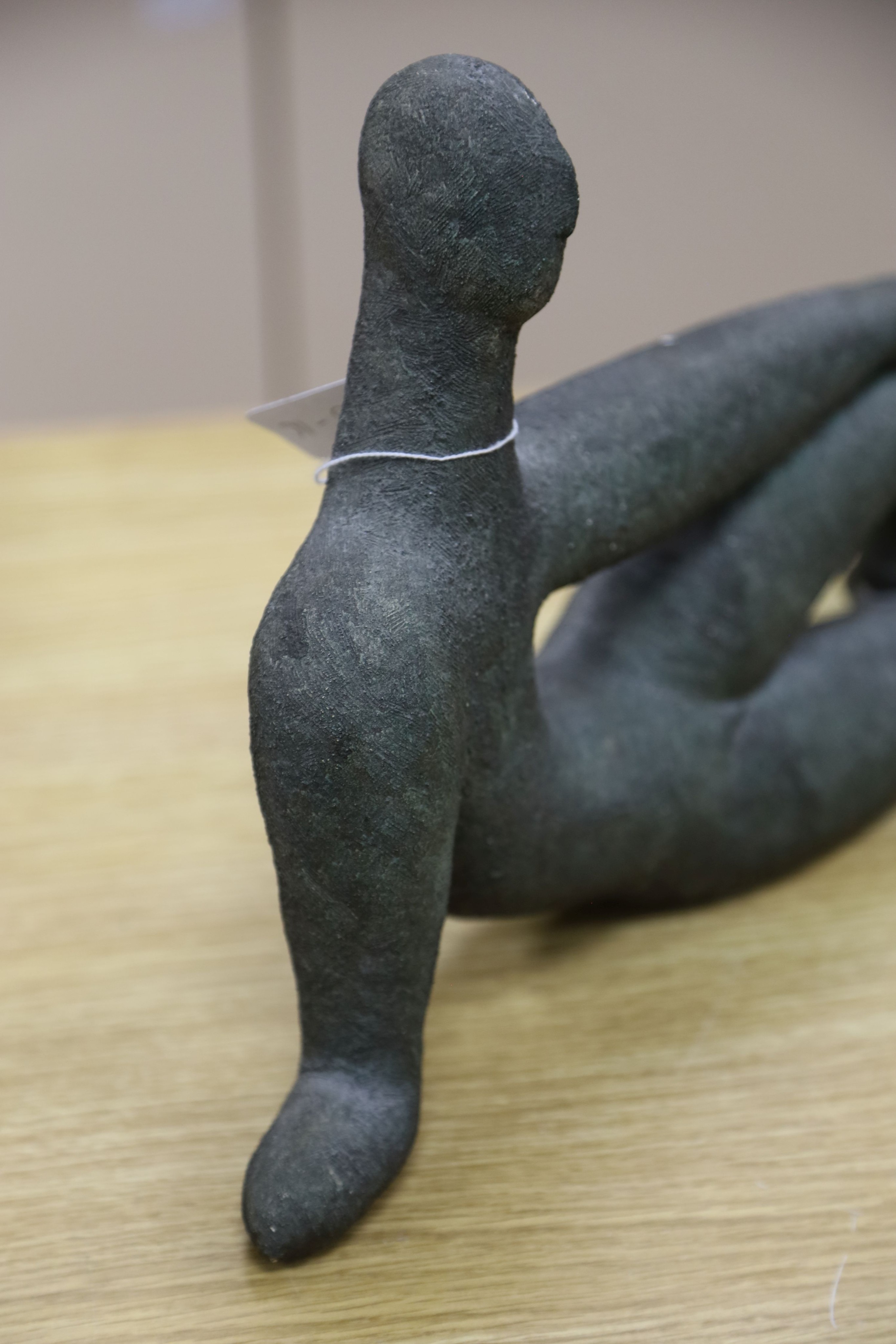 A bronzed pottery abstract figure, marked ‘WP 92’ 40cm